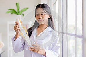 Young Asian roleplay as doctor standing happy smiling in school lab with space for text photo