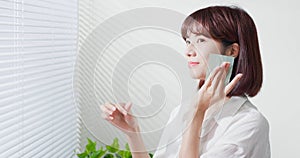 Woman use oil blotting paper photo