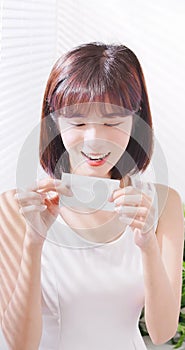Woman use oil blotting paper photo