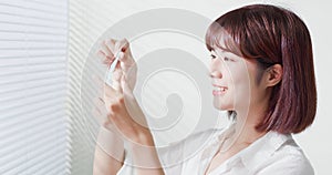 Woman use oil blotting paper photo