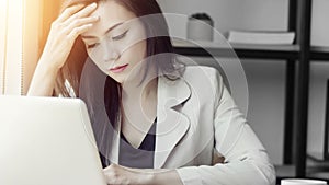Young Asian stress woman at work, depressed woman in the office.