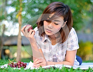 Young asian student is reading