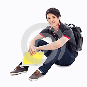 Young Asian student sitting floor.