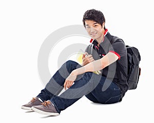 Young Asian student sitting floor.