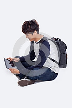 Young Asian student using pad PC