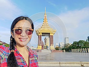 Selfie of a young woman at Norodom Sihanouk memorial, Phnom Penh, Cambodia photo
