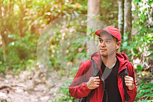 Young asian travel handsome man hiking in forest and mountain enjoy walking in nature outdoors. Image of lifestyle camping,travel,