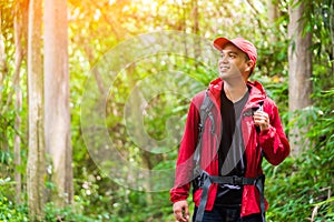 Young asian travel handsome man hiking in forest and mountain enjoy walking in nature outdoors. Image of lifestyle camping,travel,