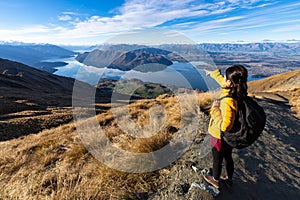 Young asian traveler backpack hiking on Roys peak track, Wanaka, South Island, New Zealand