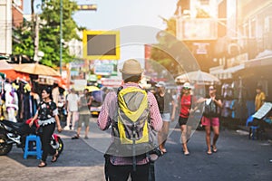 Young Asian traveling man walking in Khaosan Road walking street at Bangkok photo