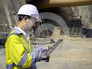 Young Asian tunnel engineering working at construction site