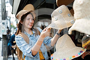 Young Asian woman backpack traveler traveling at local market. Journey trip lifestyle