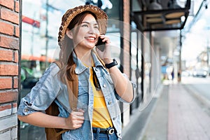 Young Asian woman backpack traveler using a mobile. Journey trip lifestyle. travel concept