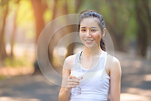 Young Asian woman and a bottle of water