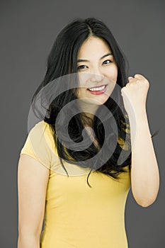 Young Asian woman celebrating success