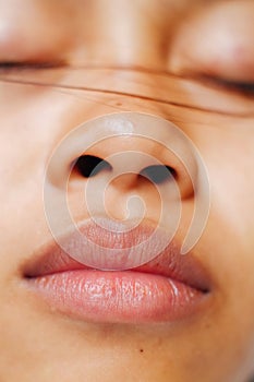 Young Asian woman closeup face sleeping during the day