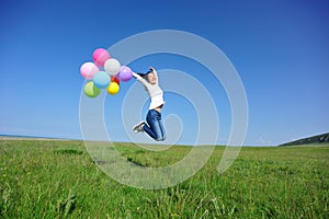 Young asian woman with colored balloons