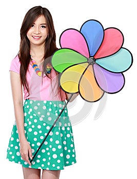 Young asian woman with colorful windmill