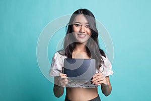 Young Asian woman with a computer tablet