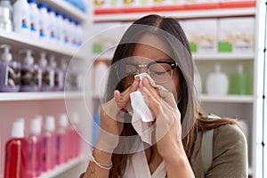 Young asian woman customer using nakpin at pharmacy