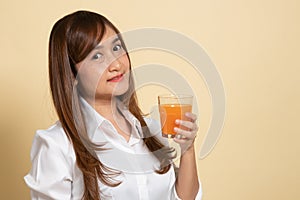 Young Asian woman drink orange juice
