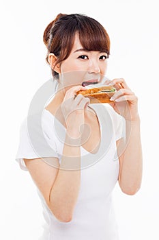 Young Asian woman eat sandwhich.