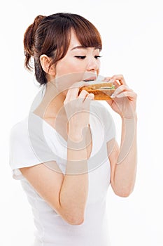 Young Asian woman eat sandwhich.