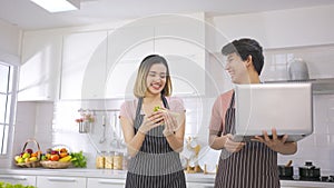 Young asian woman eating sandwich breakfast making roasted bread