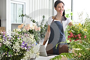 Young Asian woman entrepreneur/shop owner/ florist of a small flower shop business