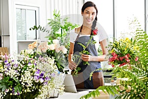 Young Asian woman entrepreneur/shop owner/ florist of a small flower shop business