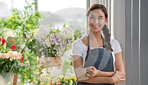 Young Asian woman entrepreneur/shop owner/ florist of a small flower shop business