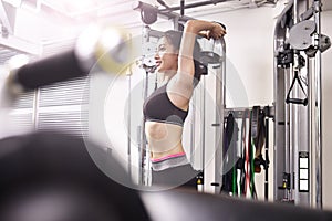 Young asian woman exercising working out in gym