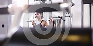 Young asian woman exercising working out in gym