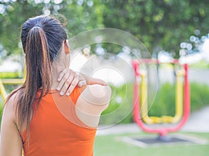 Young asian woman feel pain on her neck and shoulder