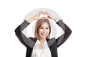 Young Asian woman gesturing heart hand sign