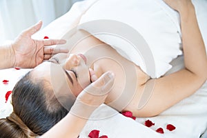A young Asian woman getting a head massage It`s in a spa shop in Bangkok