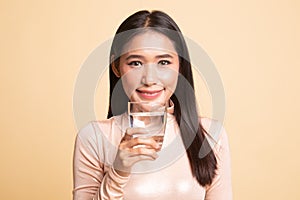 Young Asian woman with a glass of drinking water