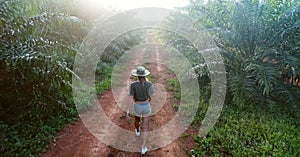 Young asian woman goes alone outdoor by the road with wild forest mountains on background Travel Lifestyle and survival