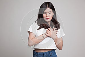 Young Asian woman got chest pain.