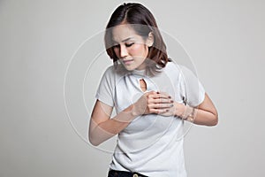 Young Asian woman got chest pain.