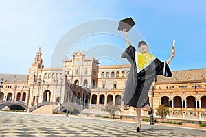 Young asian woman in graduation gown celebrate her graduation