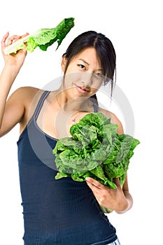 Young Asian woman with green vegetables