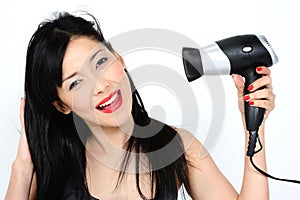 Young asian woman with hair-dryer