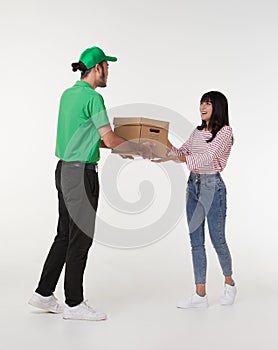 Young asian woman hand accepting a delivery of boxes from deliveryman isolated on white background