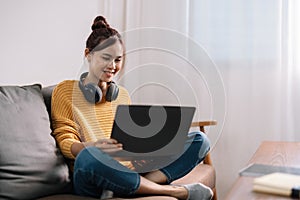 Young asian woman having conversation chatting while using laptop at house. Work at home, Video conference, Online