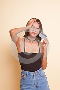 Young Asian woman headache with a blank card.