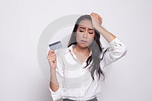 Young Asian woman headache with a blank card