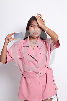 Young Asian woman headache with a blank card