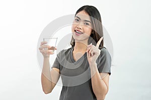 Young asian woman holding grass water isolated on white background