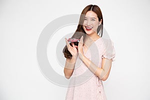 Young Asian woman holding red car model  on white background.